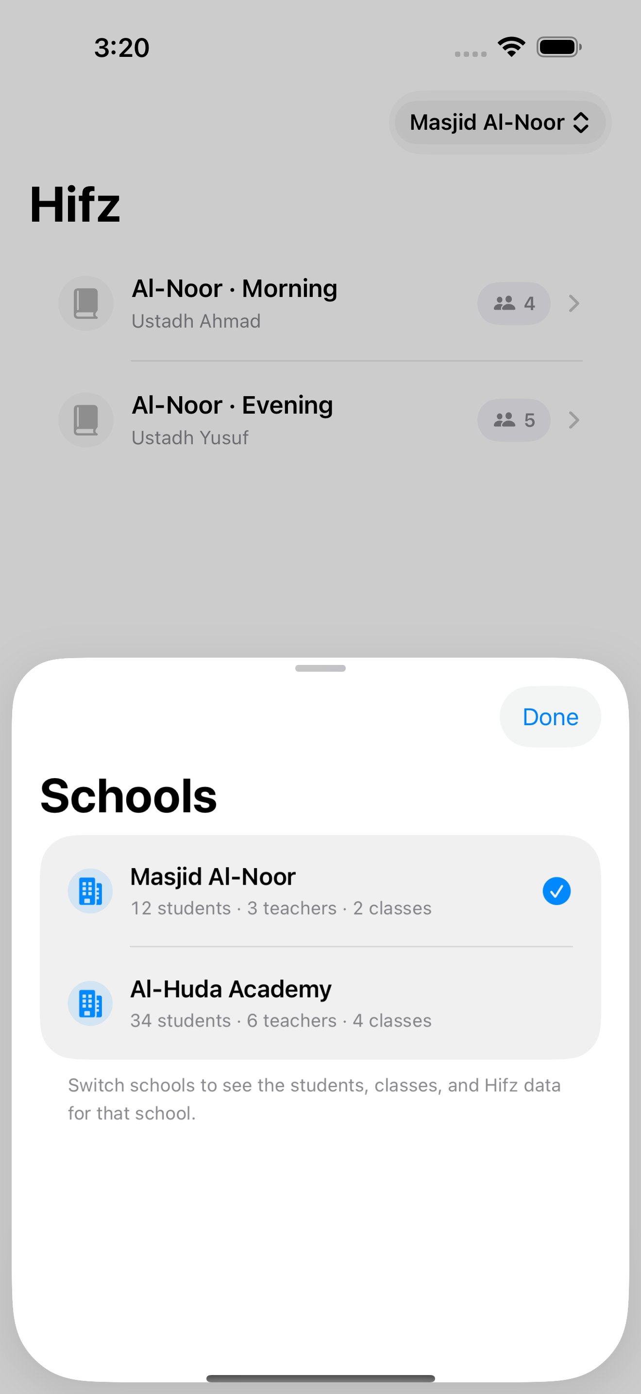 MarkTrack iOS app showing the school picker open with two schools listed under one parent account
